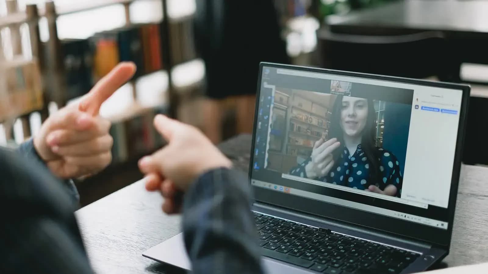 Adult learner in a 1-to-1 online lesson with a female tutor
